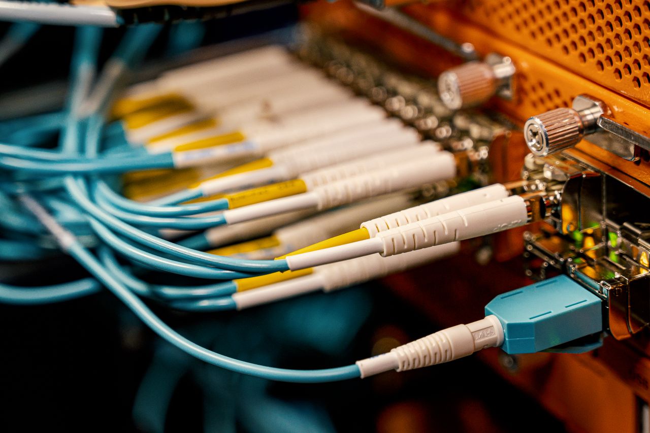 Offerings From above of optical switch equipment with many similar connectors with rubber cables and metal parts